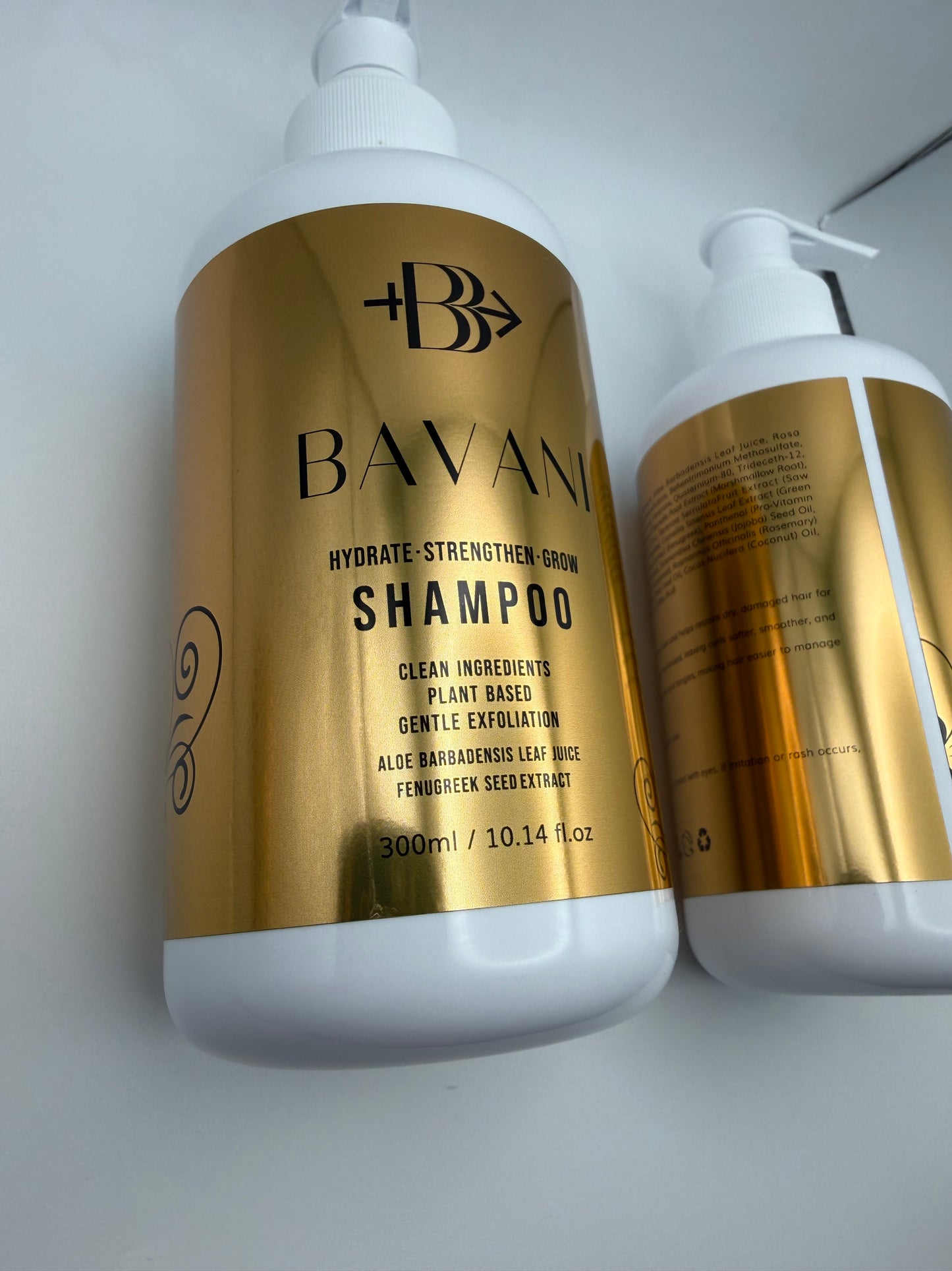 Two bottles of BAVANI shampoo on a white background